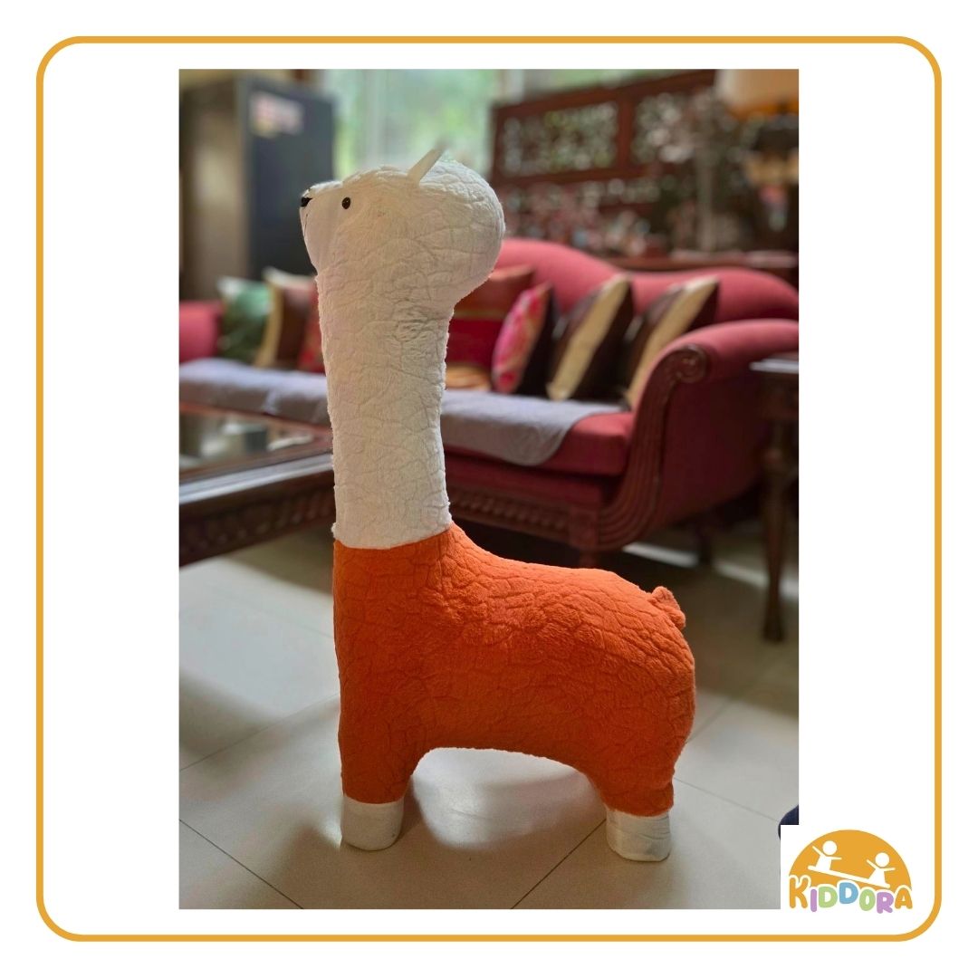Orange and white Alpaca Plush Kids Stool standing in a living room